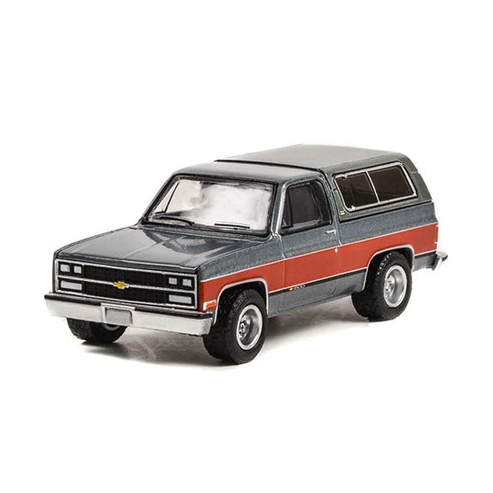 Greenlight Licensed 1:64 Scale Chevrolet K5 Blazer Lifted 1990 Diecast Model Car Grey & Red